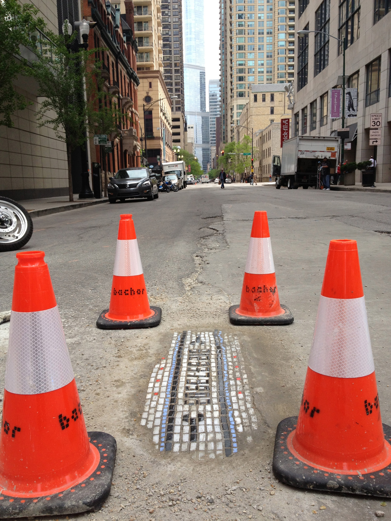 Illustration for article titled There's a Hero Repairing Chicago's Horrible Potholes With Mosaics